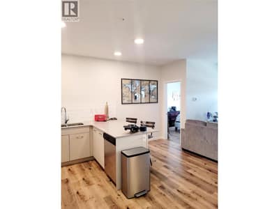 Open concept living room and kitchen with eating bar