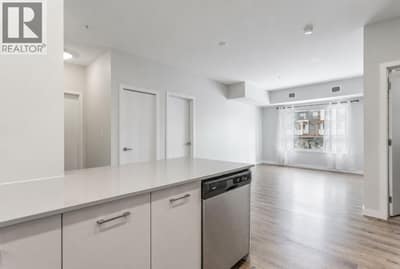 Kitchen looking into Dining Room and Living Room *Virtually Staged*