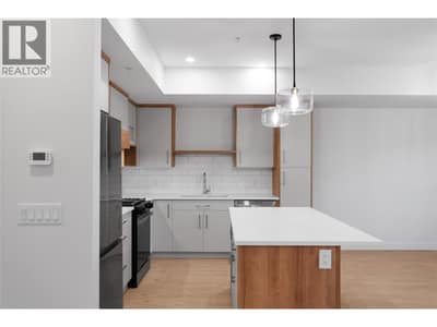 Please note photos are of Unit 107 with same kitchen colour scheme, flooring, and appliances.