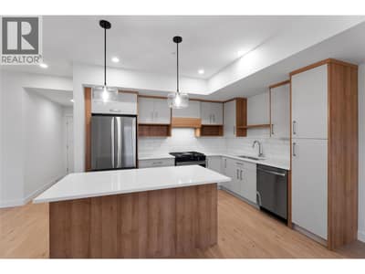 Please note photos are of Unit 107 with same kitchen colour scheme, flooring, and appliances.