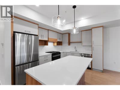 Please note photos are of Unit 107 with same kitchen colour scheme, flooring, and appliances.