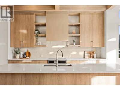 Kitchen l Main Level - Stunning kitchen with quartz countertops, 10ft kitchen island, Dekton backsplash, & stainless steel appliances through out