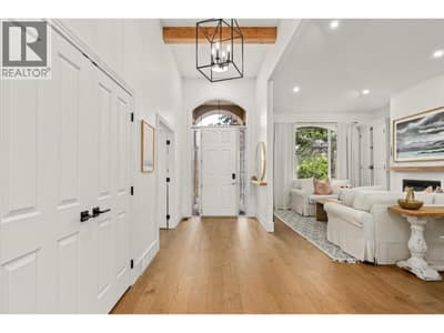 Bright and welcoming foyer with custom lighting
