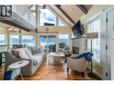 Living Area with Gas Fireplay and sliding doors to large entertaining view deck.