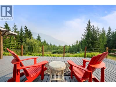 Partially covered lake-view deck spans entire width of home