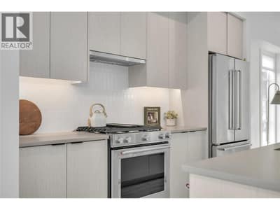 Kitchen. Photos may be of a similar home in the community.