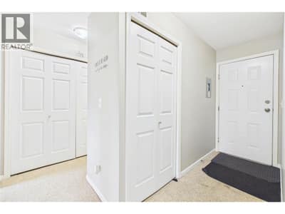 Entrance of home with front hall closet