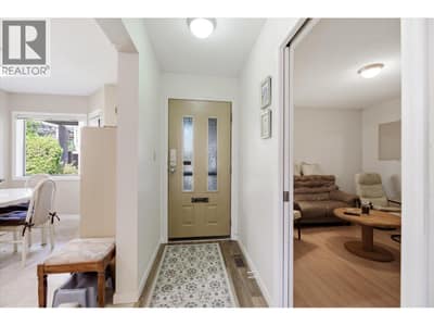 Foyer leads to the living room and on the other side the 2nd bedroom