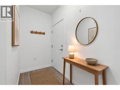 Penthouse #6 has a spacious apartment entryway (virtually staged)