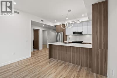 Kitchen. Photo of a similar floorplan/different colour scheme in building