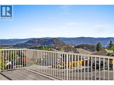 Okanagan Lake from your front deck, accessible via the main living room area.