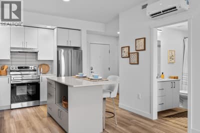 Kitchen. Photos are of a similar home; some features may vary