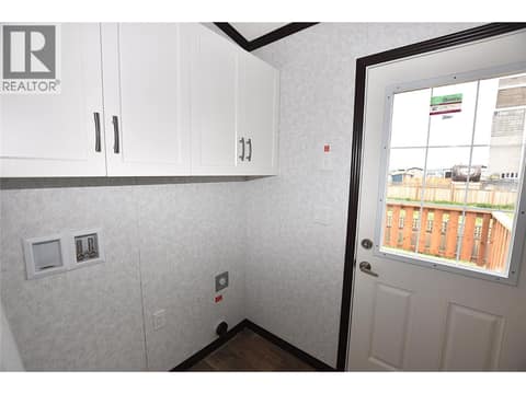 Laundry area/back door at 61 Antoine Road Unit# 24, Swan Lake West, Vernon