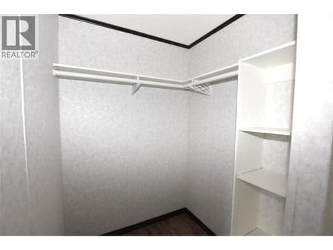 Walk in closet with barn door at 61 Antoine Road Unit# 24, Swan Lake West, Vernon