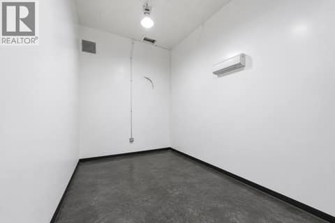 Main Level Storage Room With A/C Wall Unit 13' x 23' at 6924 / 6926 Old Kamloops Road, Swan Lake West, Vernon