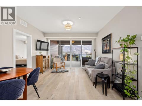 Floor to ceiling windows in the living room at 3475 Granite Close Unit# 109, McKinley Landing, Kelowna