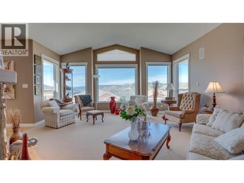 Living room with big windows to take in the view. at 667 Mt York Drive, Middleton Mountain Coldstream
