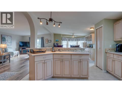 Island has counter-top space as well as additional cabinet & drawer space at 9510 Highway 97N Unit# 43, Swan Lake West, Vernon