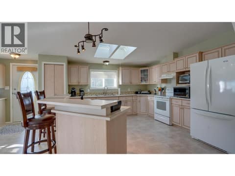 Kitchen Island is also an eat-in breakfast bar at 9510 Highway 97N Unit# 43, Swan Lake West, Vernon