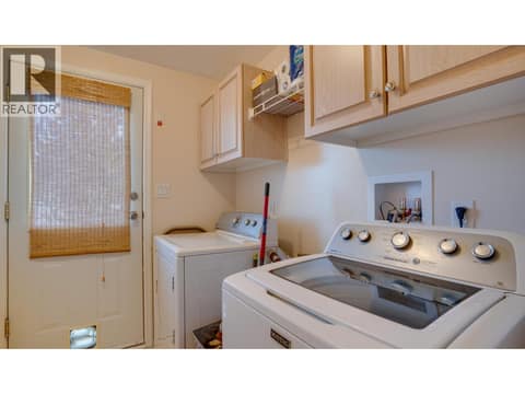 Laundry area and exterior access. at 9510 Highway 97N Unit# 43, Swan Lake West, Vernon