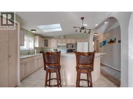 View from entryway towards the Kitchen. at 9510 Highway 97N Unit# 43, Swan Lake West, Vernon
