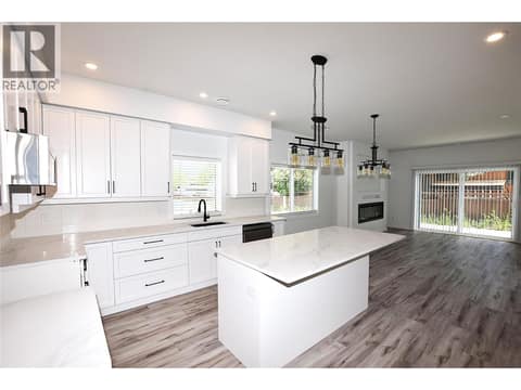 Bright white kitchen with quart countertops at 592 Nighthawk Avenue, Okanagan North, Vernon