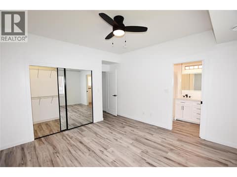 Primary bedroom with walk in closet and 3 piece en-suite at 592 Nighthawk Avenue, Okanagan North, Vernon