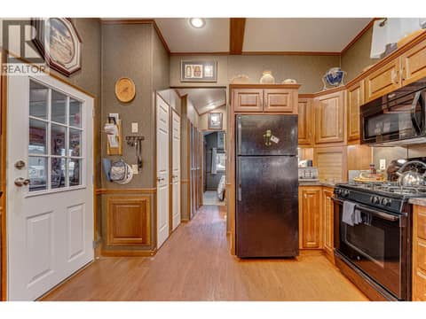 Kitchen view toward bedroom at 8000 Highland Road Unit# 42, North BX, Vernon