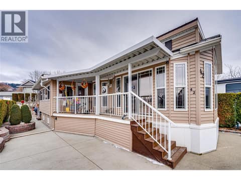 Parking and covered front entry and deck at 8000 Highland Road Unit# 42, North BX, Vernon