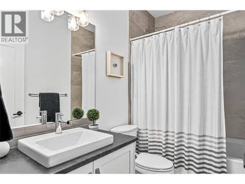4 Piece Bathroom Main Level at 209 Ashcroft Place, Predator Ridge, Vernon