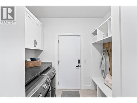Laundry / Mudroom just off Garage at 209 Ashcroft Place, Predator Ridge, Vernon