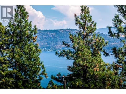 View from Drone to approximate level of second floor of a home at midpoint of lot. at 10523 Westshore Road, Okanagan North, Vernon