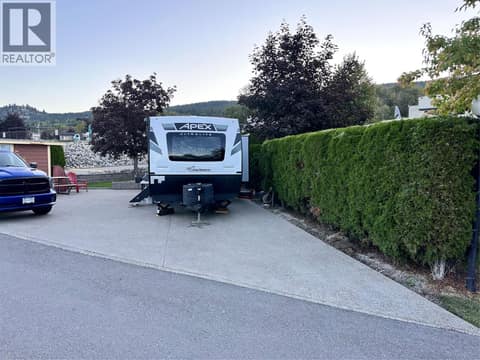 Large entry onto this wide lot with easy access for your RV at 8000 Highland Road Lot# 15, North BX, Vernon