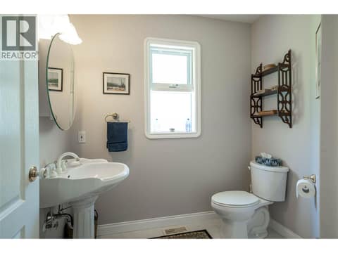Lower Level Floor:  2PC Bathroom at 7821 Old Kamloops Road, Swan Lake West, Vernon