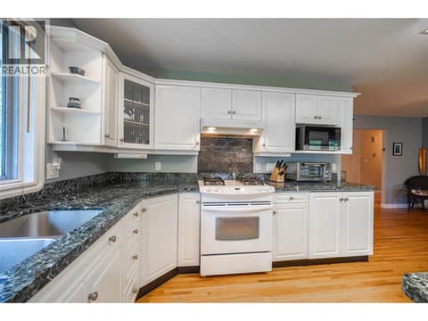 Upper Main Level: Open Plan Kitchen at 7821 Old Kamloops Road, Swan Lake West, Vernon