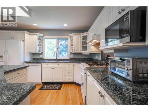 Upper Main Level: Open Plan Kitchen at 7821 Old Kamloops Road, Swan Lake West, Vernon