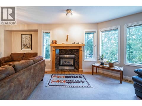 Upper Main Level:  Living Room at 7821 Old Kamloops Road, Swan Lake West, Vernon