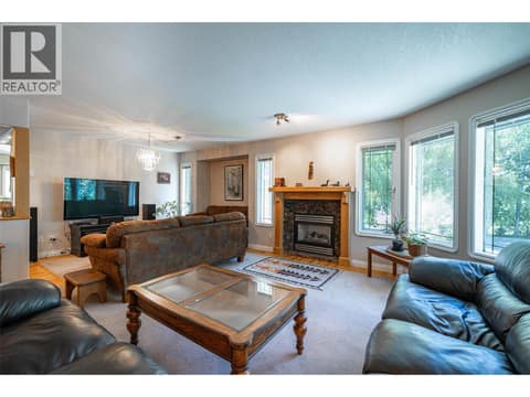 Upper Main Level:  Living Room & Formal Dining Area at 7821 Old Kamloops Road, Swan Lake West, Vernon