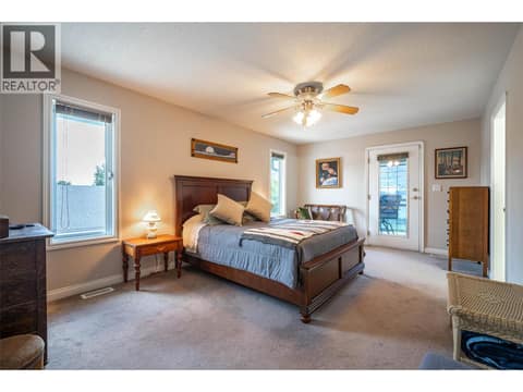 Upper Main Level: #1 Primary Bedroom with Ensuite at 7821 Old Kamloops Road, Swan Lake West, Vernon