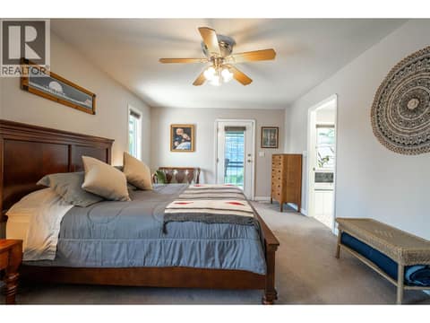 Upper Main Level: #1 Primary Bedroom with Ensuite at 7821 Old Kamloops Road, Swan Lake West, Vernon