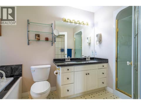 Upper Main Level: Primary Ensuite at 7821 Old Kamloops Road, Swan Lake West, Vernon