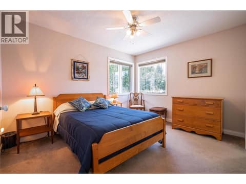 Upper Main Level: #3 Bedroom with 4PC Cheater Bathroom at 7821 Old Kamloops Road, Swan Lake West, Vernon