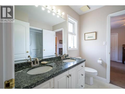 Upper Main Level: Cheater 4PC Bathroom at 7821 Old Kamloops Road, Swan Lake West, Vernon