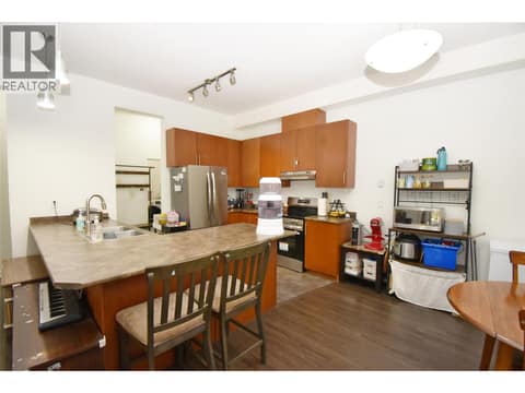 Great kitchen island with eating bar at 4205 27 Street Unit# 102, City of Vernon