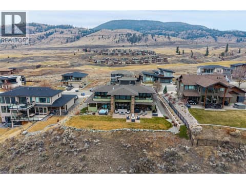 Aerial view of the back of the home and bluff at 229 Holloway Drive, Tobiano, Kamloops