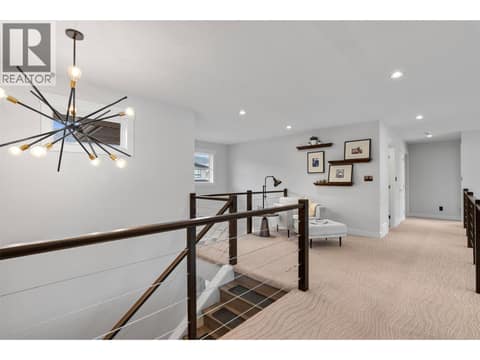 As you come up to the second level at 229 Holloway Drive, Tobiano, Kamloops