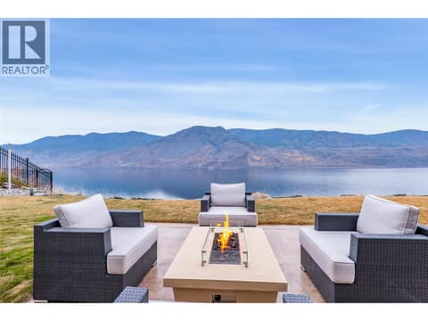 Enjoy this warm firepit just outside the dining area at 229 Holloway Drive, Tobiano, Kamloops