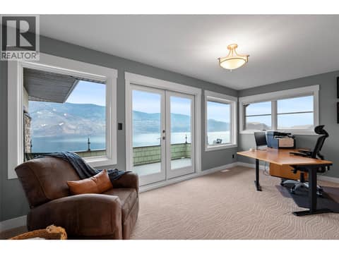 First of three upper bedrooms - this one used as an office area at 229 Holloway Drive, Tobiano, Kamloops