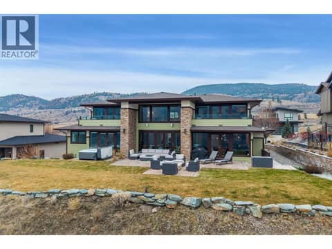 Stately designed back of this home situated on a bluff overlooking Kamloops Lake at 229 Holloway Drive, Tobiano, Kamloops