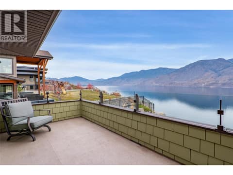 This bedroom with its own private balcony at 229 Holloway Drive, Tobiano, Kamloops
